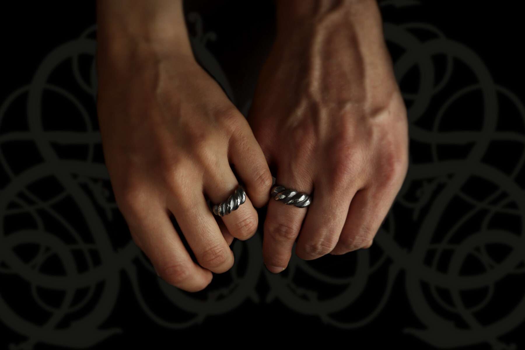 008081-hands handmade silver viking twist wedding rings
