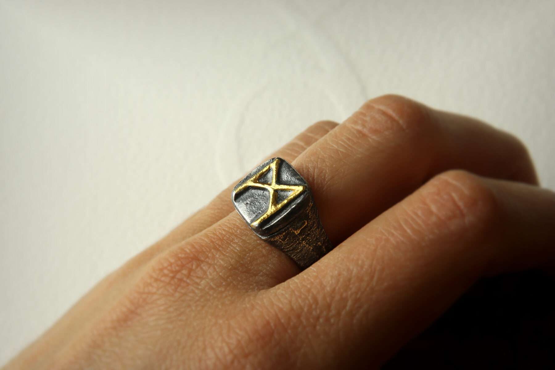 handmade silver and gold mannaz signet ring